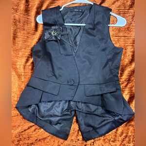 Sleeveless Black Peplum Vest with Decorative Brooch - Unbranded